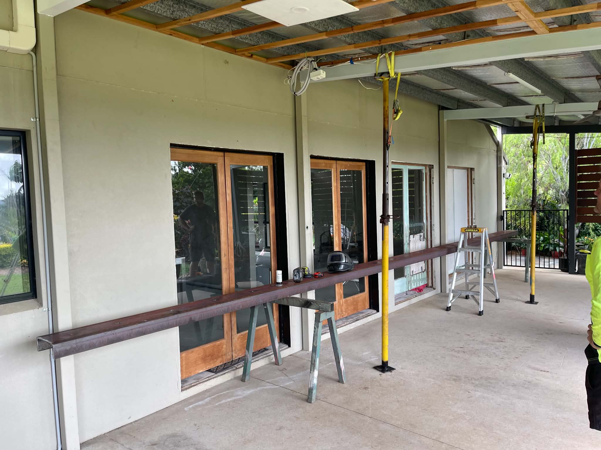 Covered walkway with steel posts and balustrade
